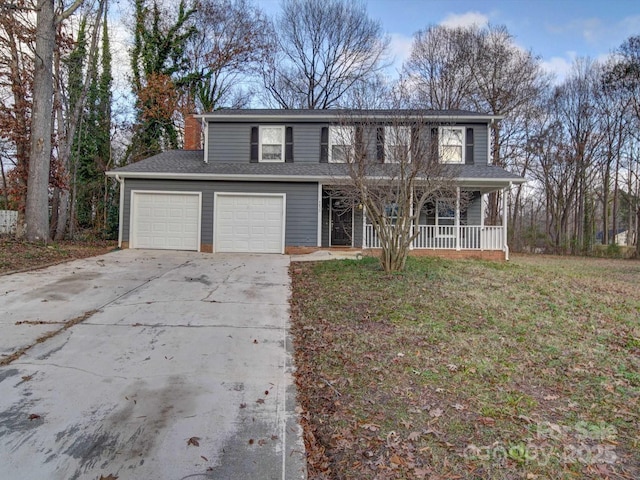 front facade featuring a garage, a front yard, and a porch