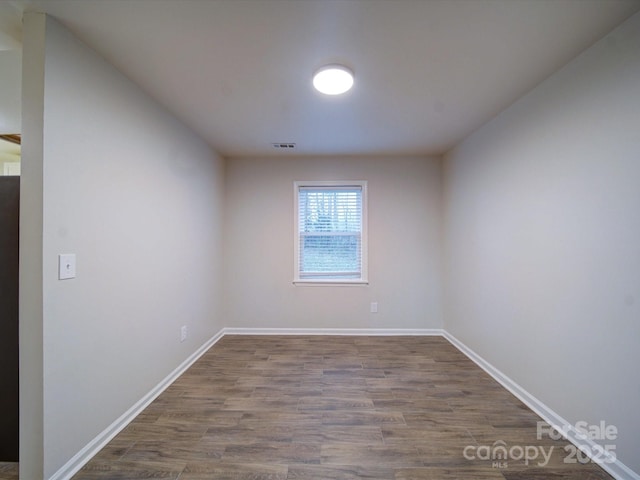 empty room featuring wood-type flooring