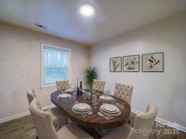 dining room featuring dark hardwood / wood-style floors