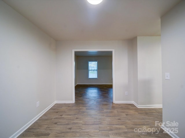 spare room with hardwood / wood-style floors