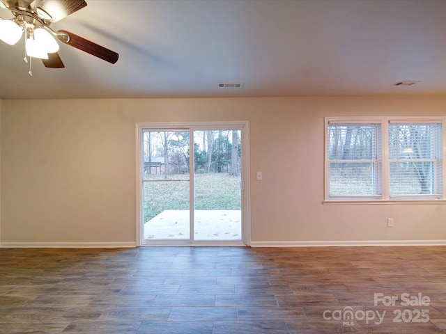 spare room featuring ceiling fan and wood-type flooring