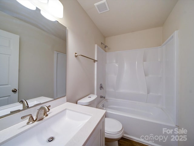 full bathroom featuring toilet, shower / washtub combination, and vanity