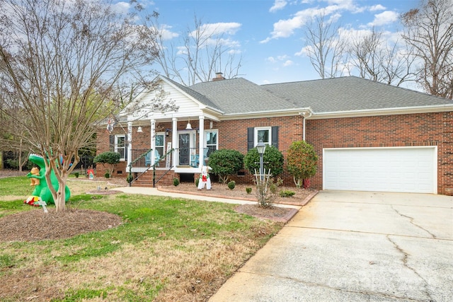 view of front facade featuring covered porch, a garage, and a front lawn