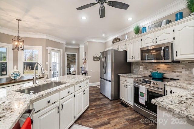 kitchen with sink, stainless steel appliances, dark hardwood / wood-style floors, decorative backsplash, and white cabinets