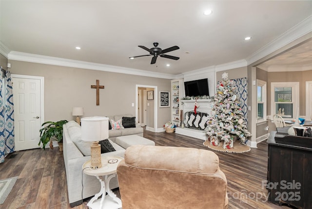 living room with ornamental molding, ceiling fan, and dark wood-type flooring