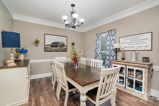 dining room featuring a chandelier, dark hardwood / wood-style floors, and ornamental molding