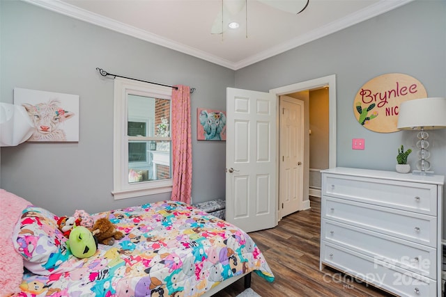 bedroom featuring dark hardwood / wood-style flooring, ceiling fan, and ornamental molding