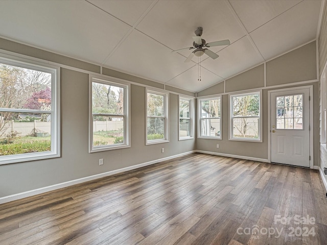 unfurnished sunroom featuring ceiling fan