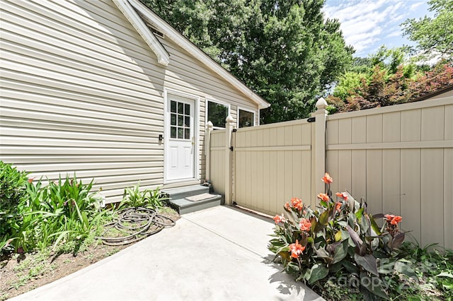 entrance to property featuring a patio area