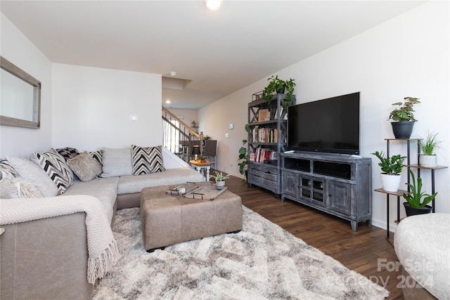 living room featuring dark wood-type flooring