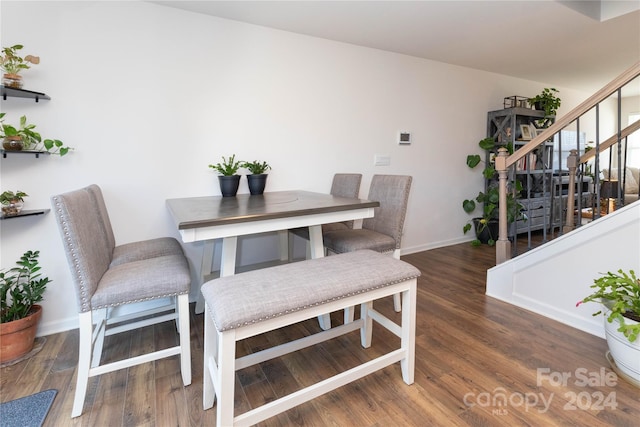 dining area with dark hardwood / wood-style floors