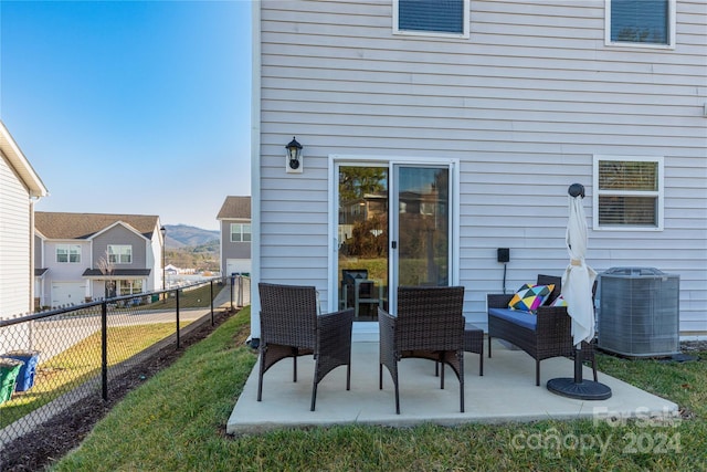 back of property featuring a patio area, a yard, and central AC unit