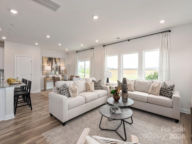 living room with light hardwood / wood-style flooring