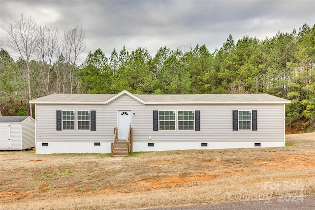 manufactured / mobile home with a shed