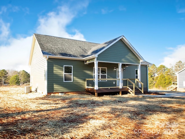 view of front facade with central AC unit and a porch