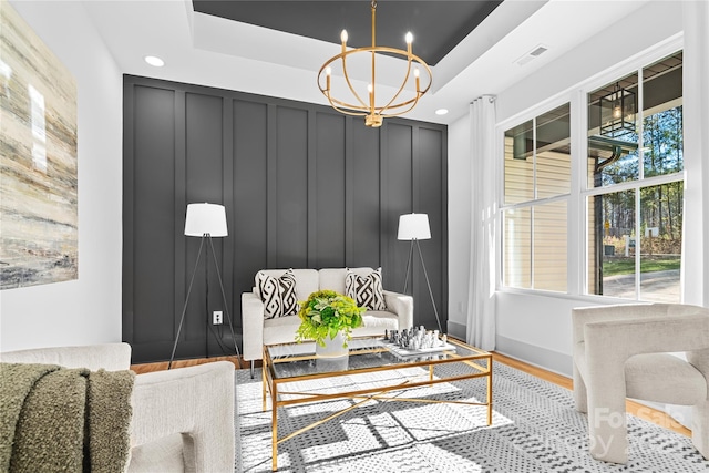 living room featuring a chandelier and hardwood / wood-style flooring