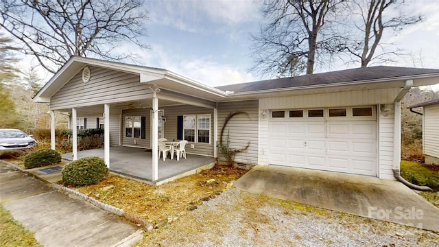 view of front of property featuring a porch and a garage