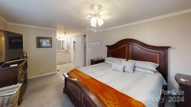 carpeted bedroom with ceiling fan, crown molding, and ensuite bathroom