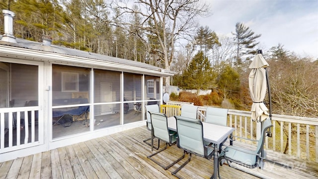 wooden terrace featuring a sunroom