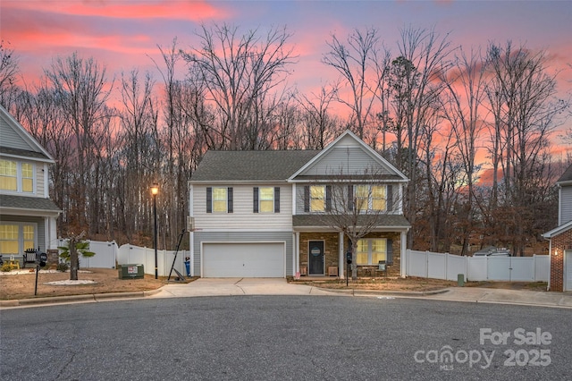 view of front of property with a garage