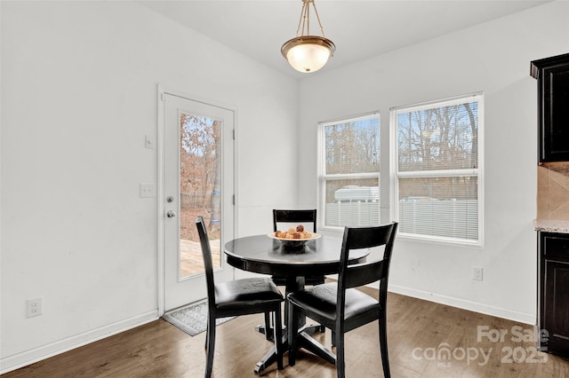 dining space featuring dark hardwood / wood-style flooring