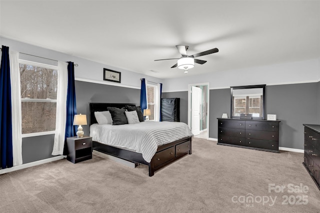 carpeted bedroom featuring ceiling fan