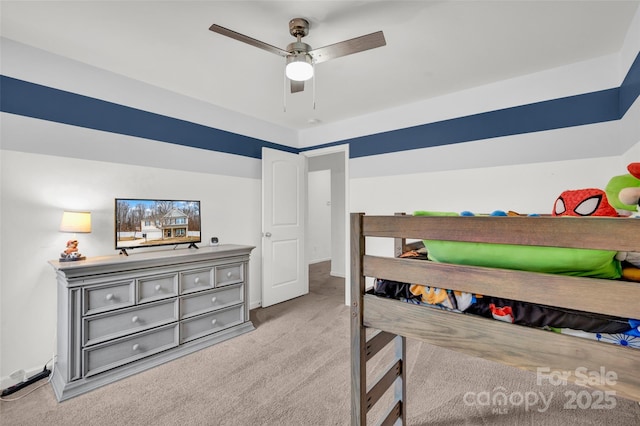 bedroom featuring light carpet and ceiling fan