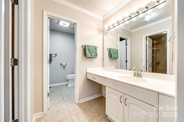 bathroom featuring vanity, tile patterned flooring, toilet, ornamental molding, and a textured ceiling