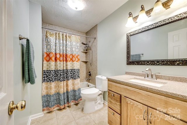 full bathroom featuring vanity, shower / bath combo, tile patterned flooring, toilet, and a textured ceiling