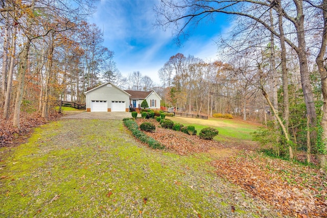 exterior space with a front yard and a garage