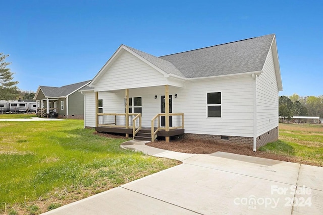 view of front of home with a front lawn and a porch