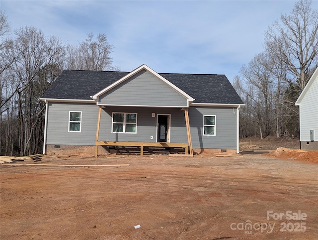 view of front of house with crawl space, a shingled roof, and a porch