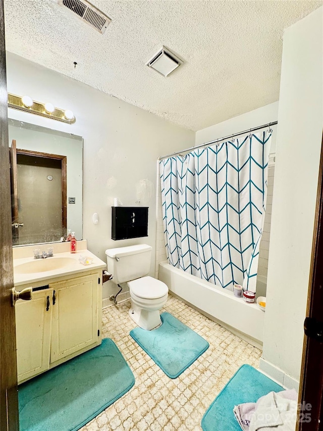 full bathroom featuring vanity, shower / tub combo, a textured ceiling, and toilet