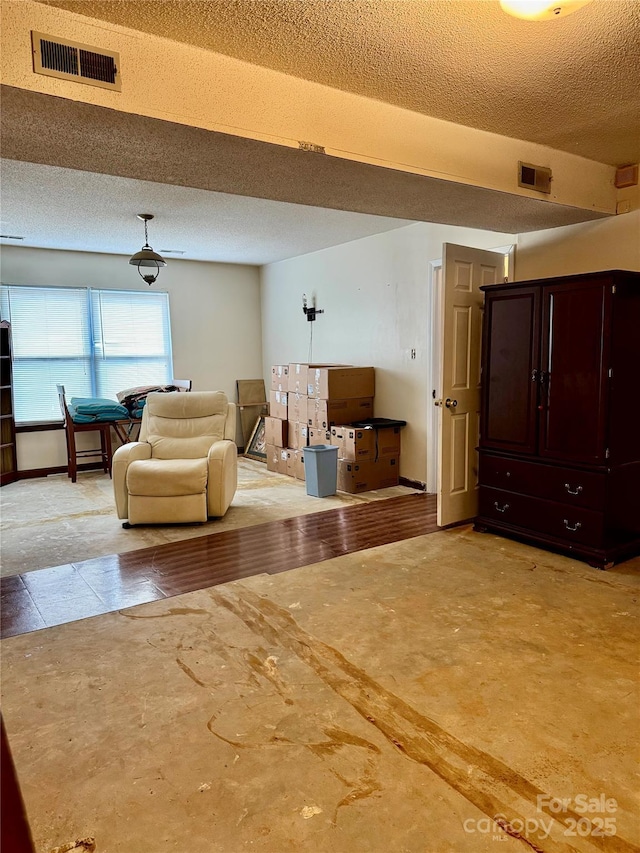 interior space featuring a textured ceiling