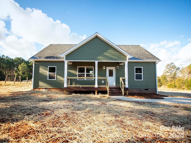 view of front of property with a porch, crawl space, and a shingled roof