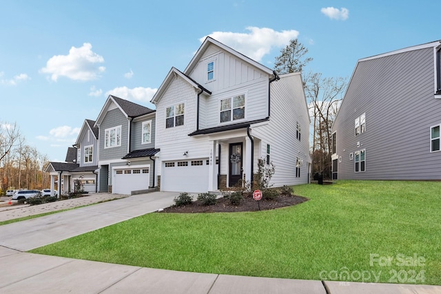 view of front of property featuring a garage and a front yard