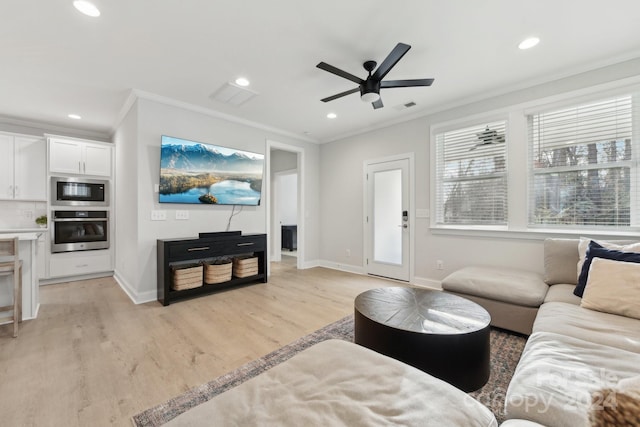 living room with ceiling fan, light wood-type flooring, and crown molding