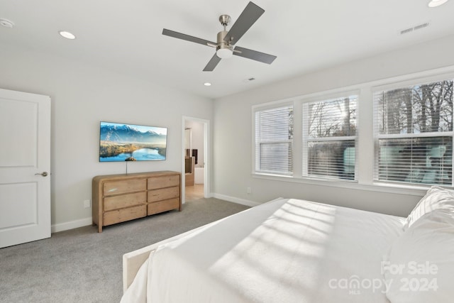 bedroom with ceiling fan and light colored carpet