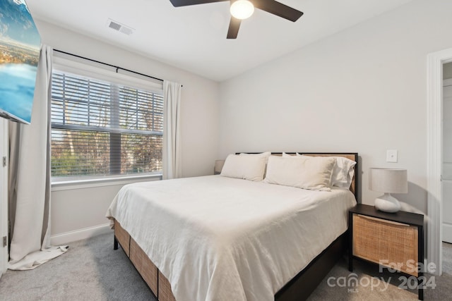 bedroom with light colored carpet and ceiling fan