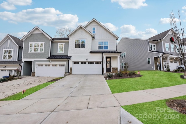 view of front of house with a garage and a front yard