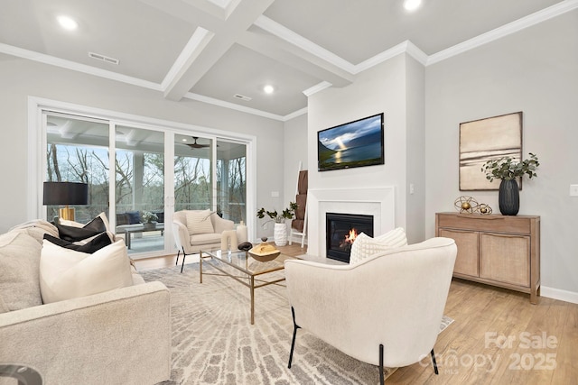 living room with crown molding, beam ceiling, coffered ceiling, and light hardwood / wood-style floors