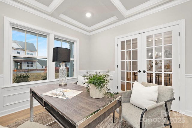 interior space featuring coffered ceiling, ornamental molding, french doors, and beamed ceiling