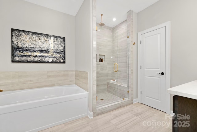 bathroom with tile patterned floors and independent shower and bath