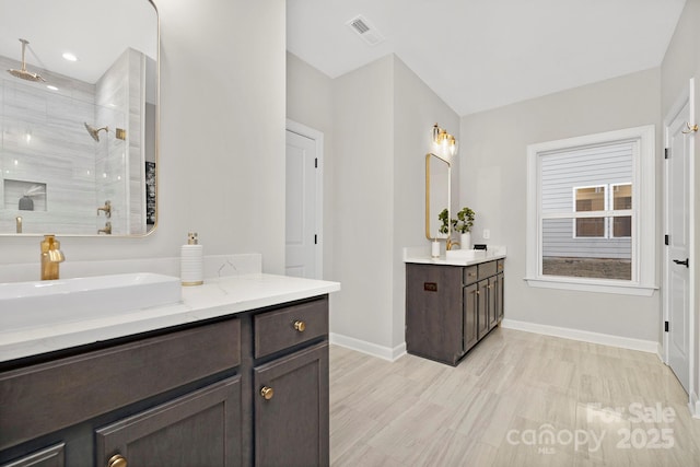 bathroom with vanity and walk in shower