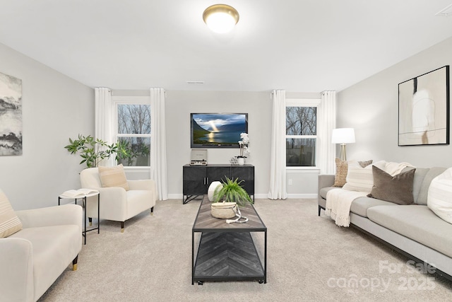 living room featuring light carpet