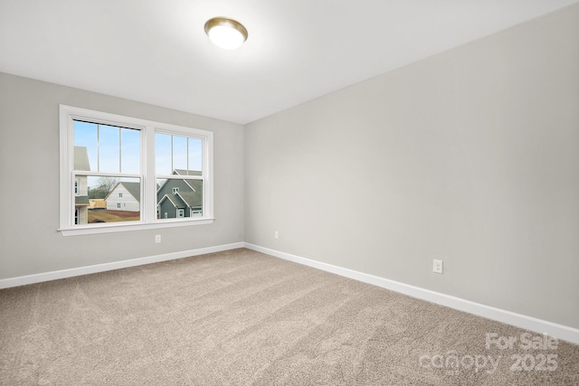 unfurnished room featuring carpet flooring