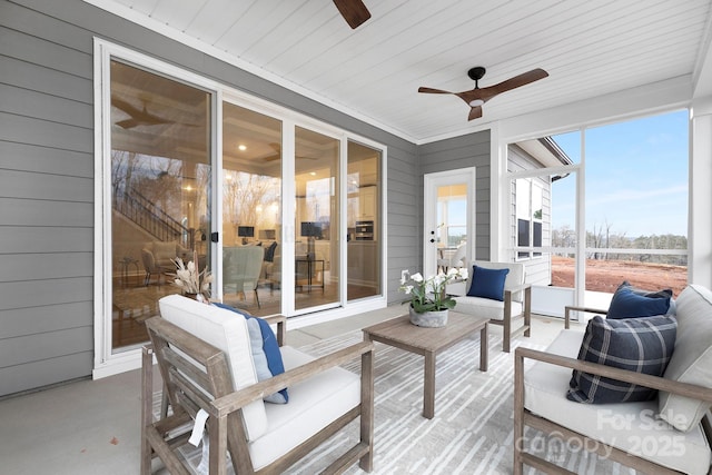 sunroom featuring wooden ceiling and ceiling fan