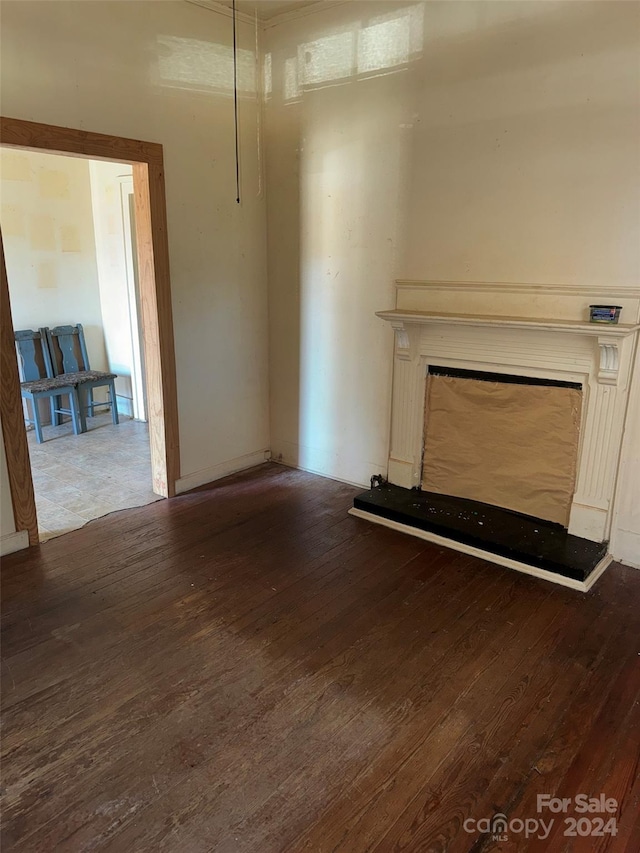 unfurnished living room with hardwood / wood-style flooring