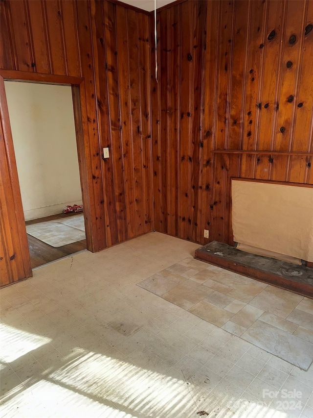 empty room with wood walls