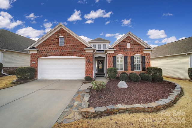 front of property with a garage